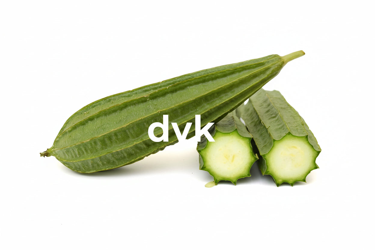 Green okra pods with a cut one on a
