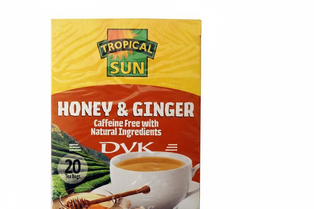 Tropical Sun Honey & Ginger tea package with a cup of tea and honey on a wooden surface.