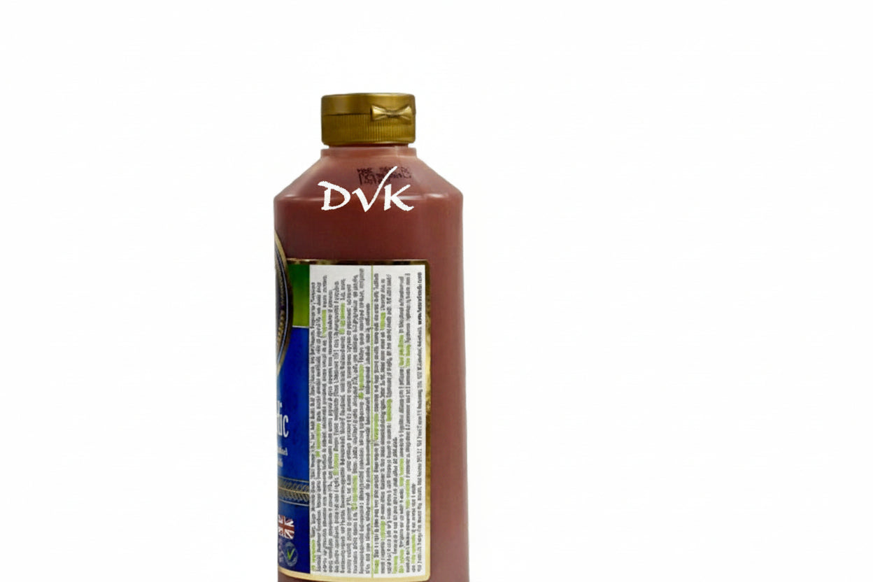 Bottle of Heinz ketchup with a gold cap on a white background