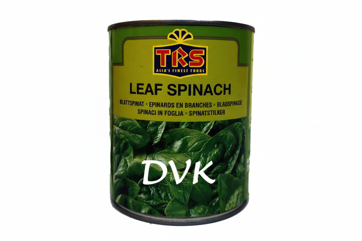 Can of TRS Leaf Spinach with green leaves on a white background