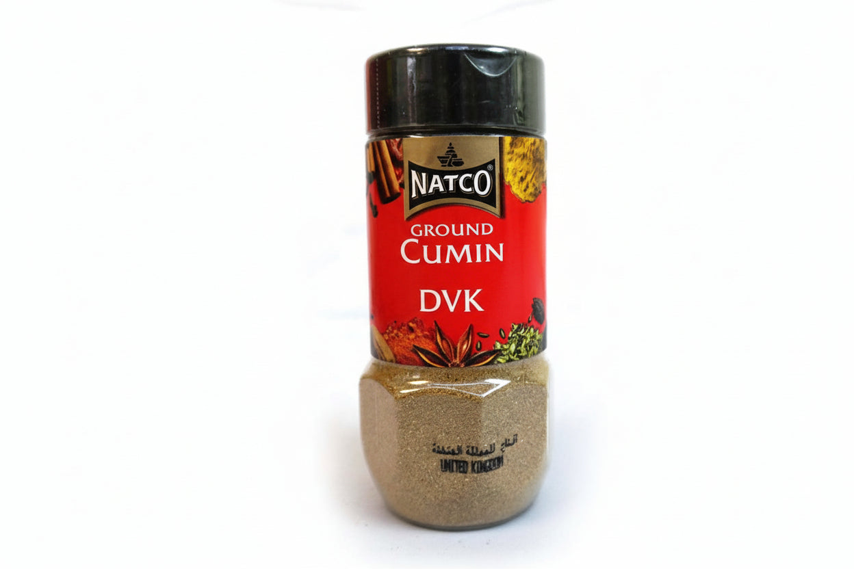 Jar of ground cumin with Natco brand on a white background