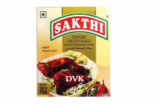 Sakthi Tandoori Chicken Masala spice mix packaging with chicken dish on a white background