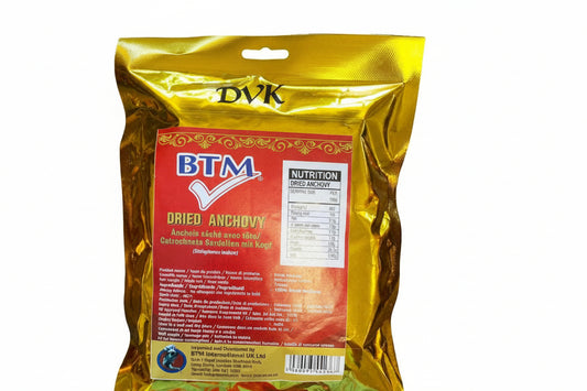 Packaged dried anchovies with gold and red label on a white background