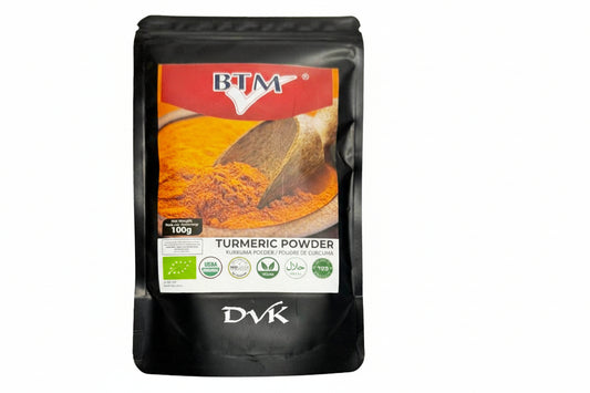 Black bag of BTM Turmeric Powder with a red label on a white background