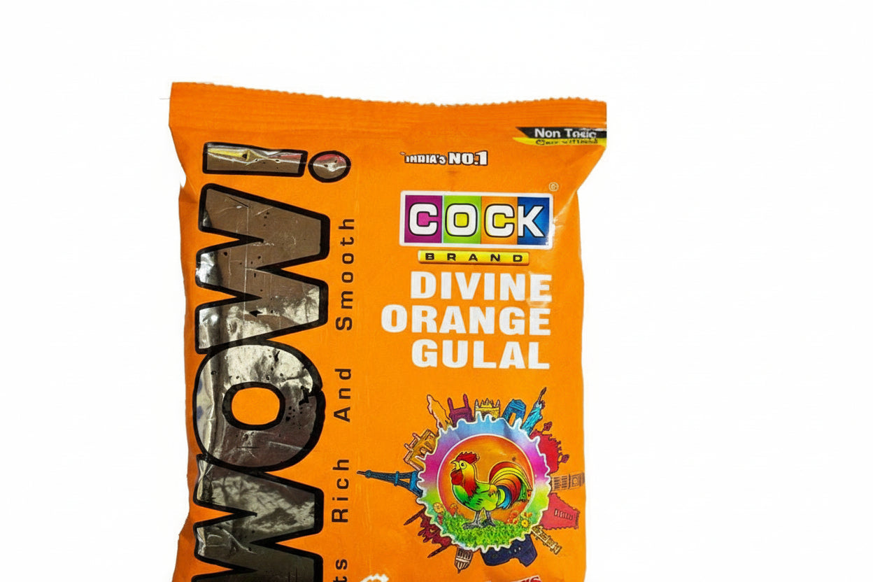 Orange packet of Cock Brand Divine Orange Gulal with 'WOW' text on a white background