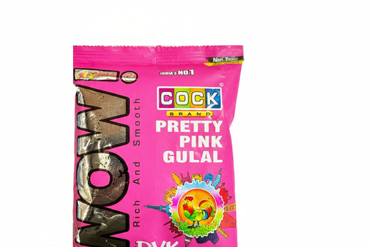 Pink packet of Cock Brand Pretty Pink Gulal with colorful text and graphics on a white background
