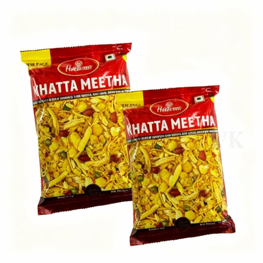 Two packets of Haldiram's Khatta Meetha on a white background