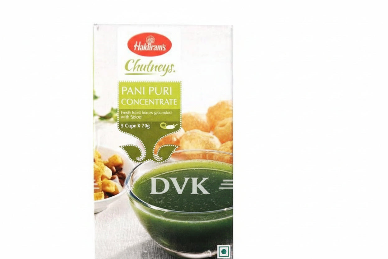 Packaging of Haldiram's Pani Puri Concentrate with a bowl of green soup and fried snacks on a white background.