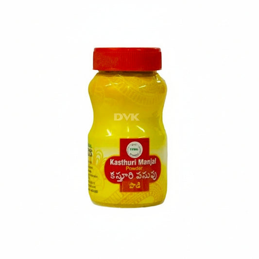 Yellow jar of Kasthuri Manjal Powder with a red lid on a white background