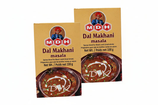 Two packages of MDH Dal Makhani masala on a white background