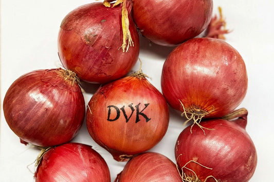 Red onions with 'DVK's' branding on a white background