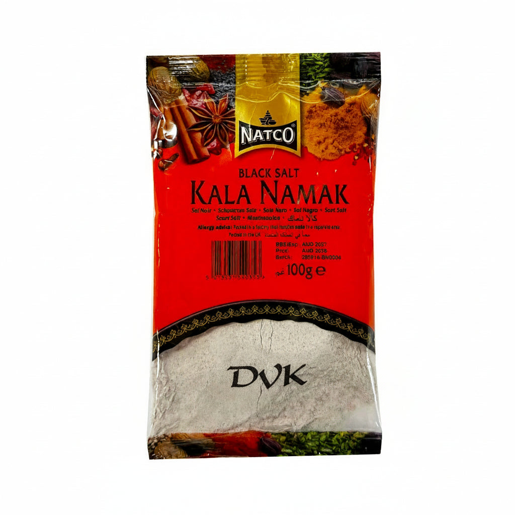 Red package of Natco Kala Namak black salt with spices on a white background