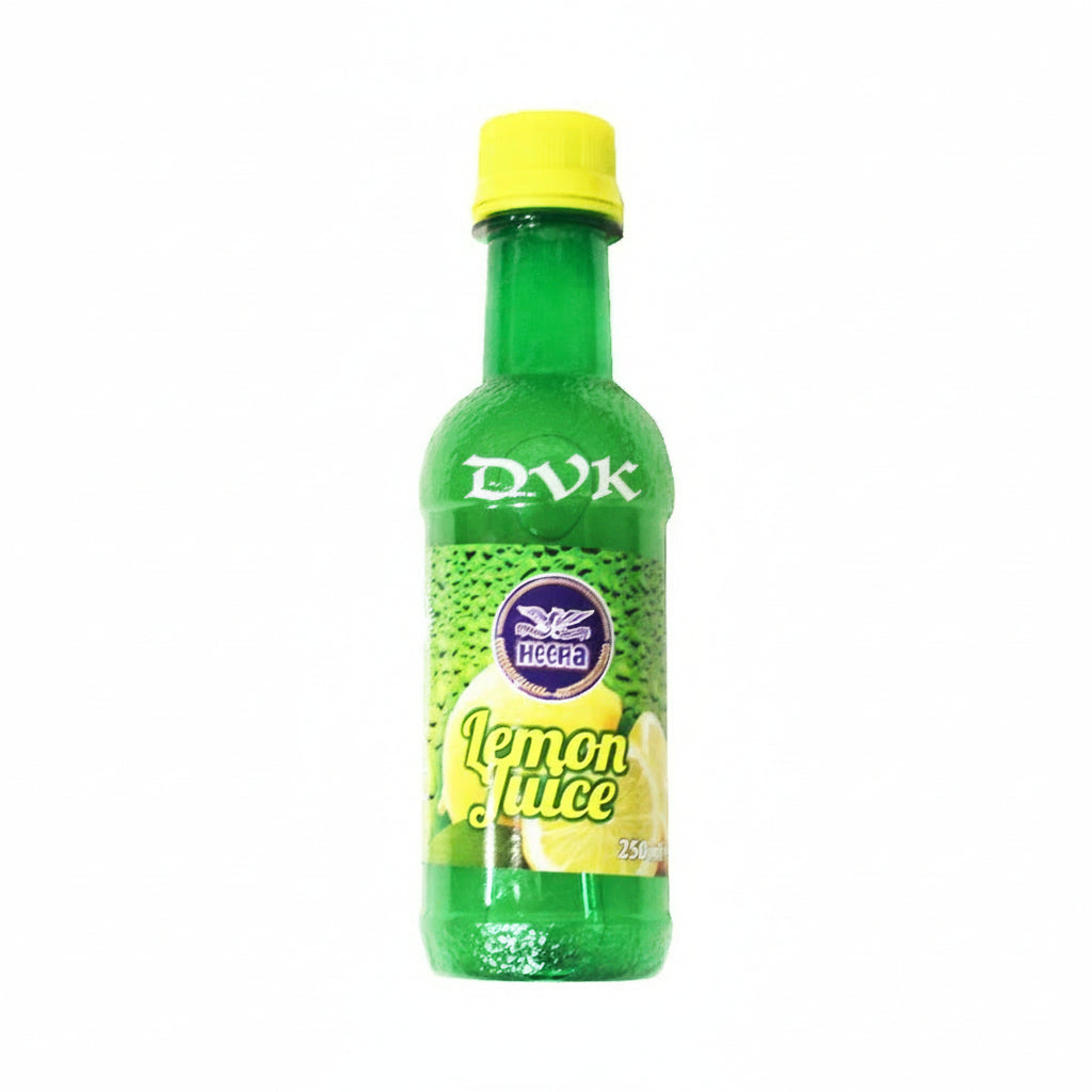 Green bottle of  lemon juice with a yellow cap on a white background