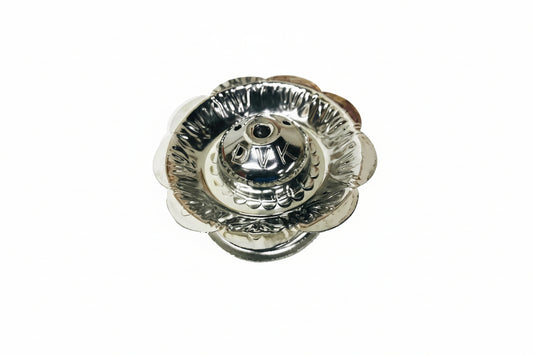 Silver flower-shaped object on a white background