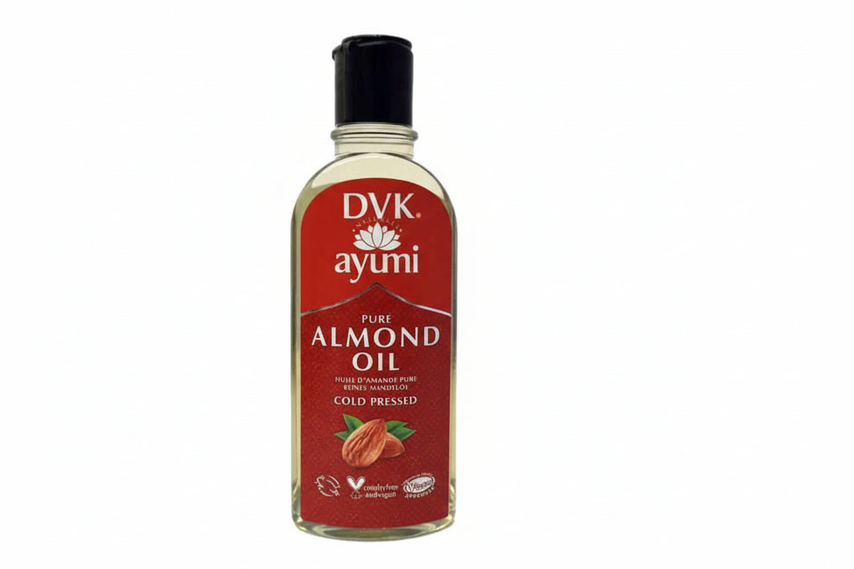 Bottle of AYUMI pure almond oil with a red label on a white background