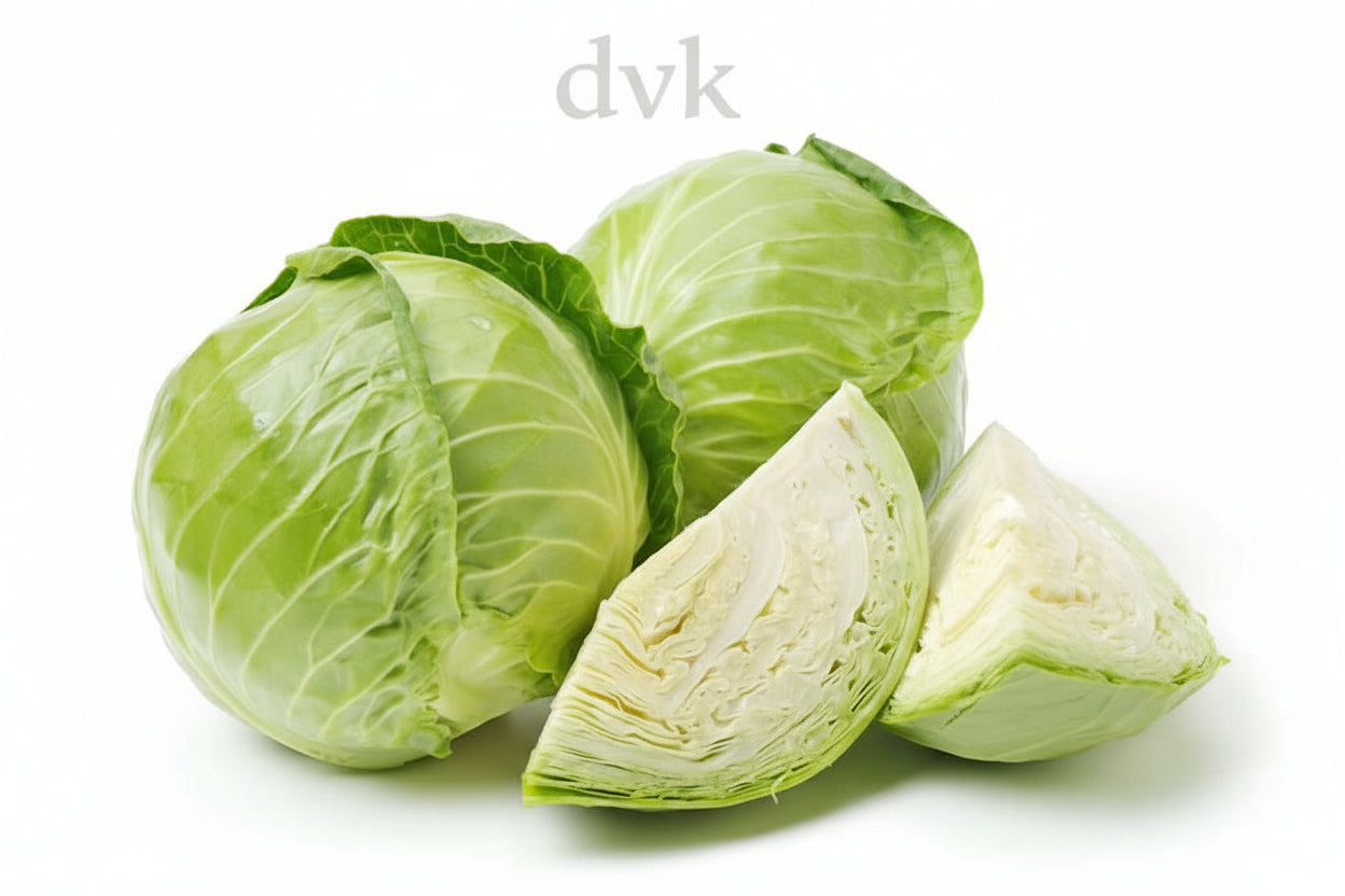 Green cabbage with a cut piece on a white background