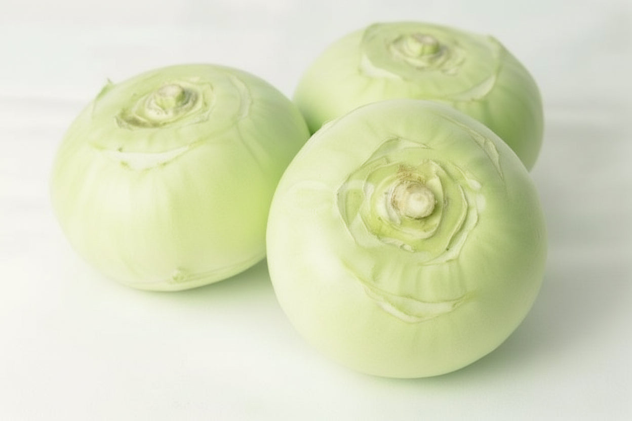 Three green cabbages on a white background