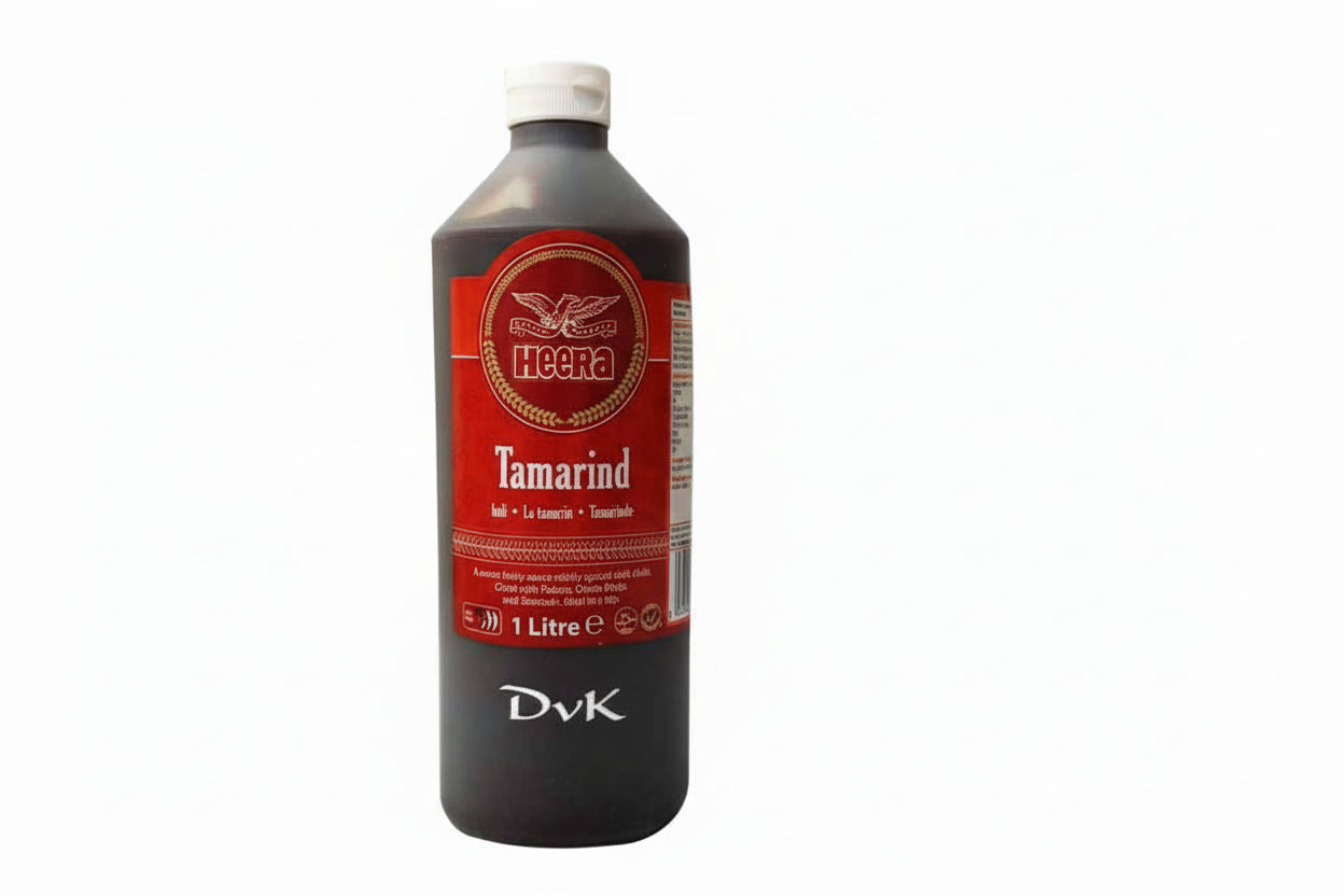Bottle of Heera Tamarind juice with a red label on a white background