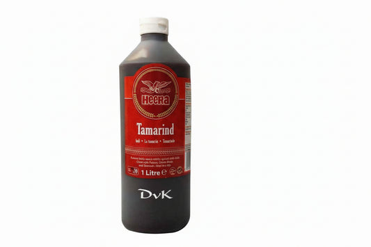 Bottle of Heera Tamarind juice with a red label on a white background