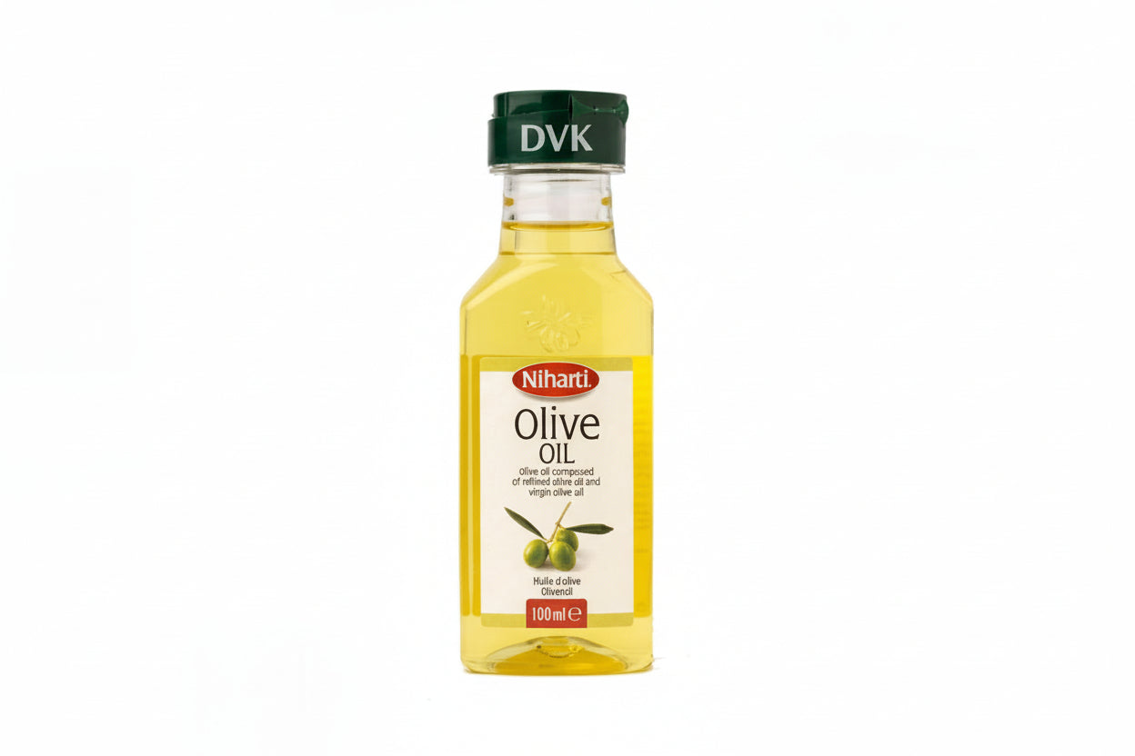 Bottle of olive oil with a green cap on a white background