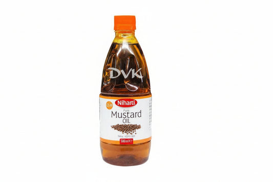 Bottle of Niharti Pure Mustard Oil with orange cap on a white background